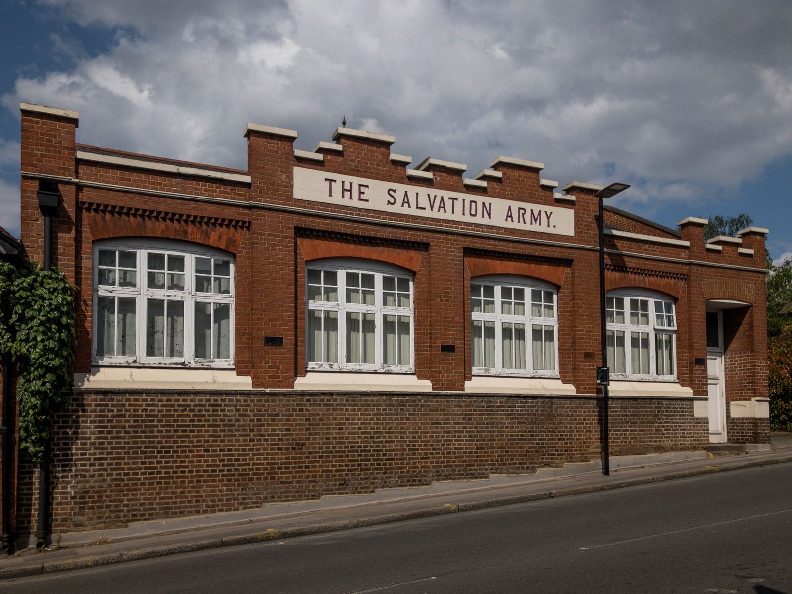 Salvation Army cooling station sign welcoming residents during a summer heat wave
