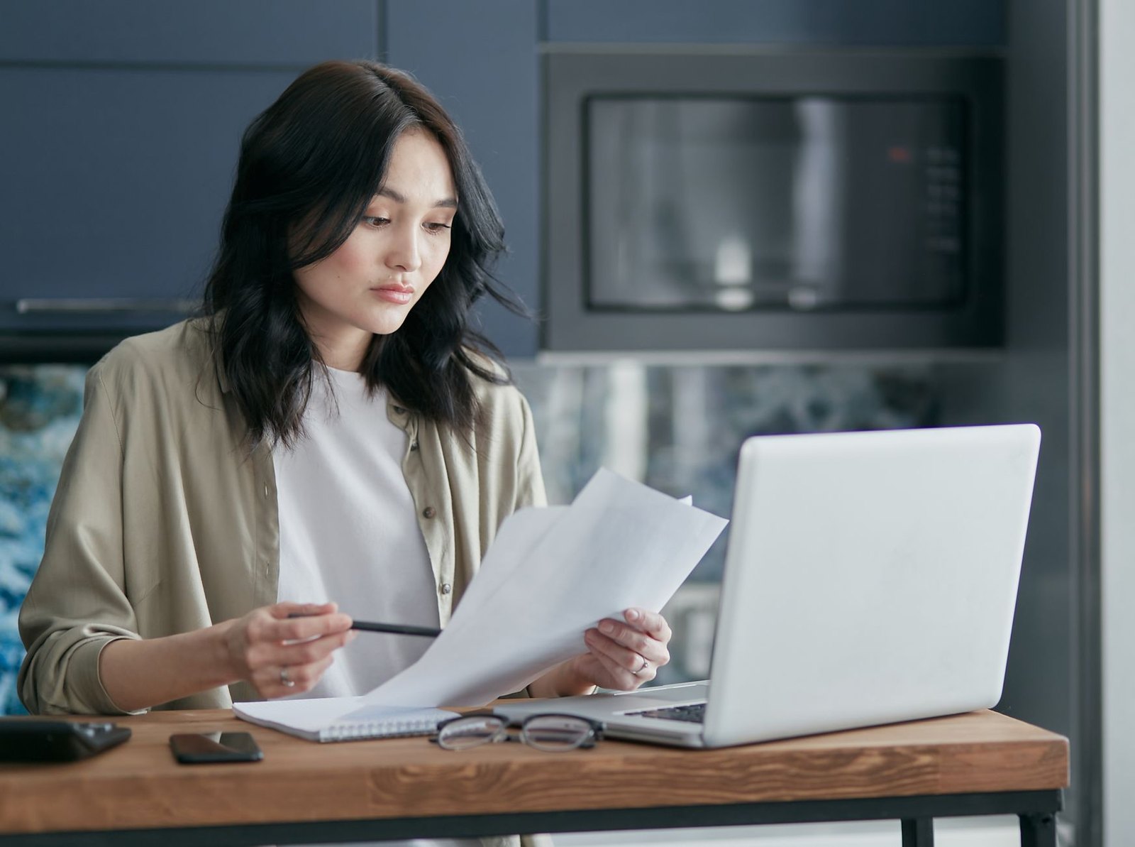 Parent uploading school enrollment documents online before a registration deadline