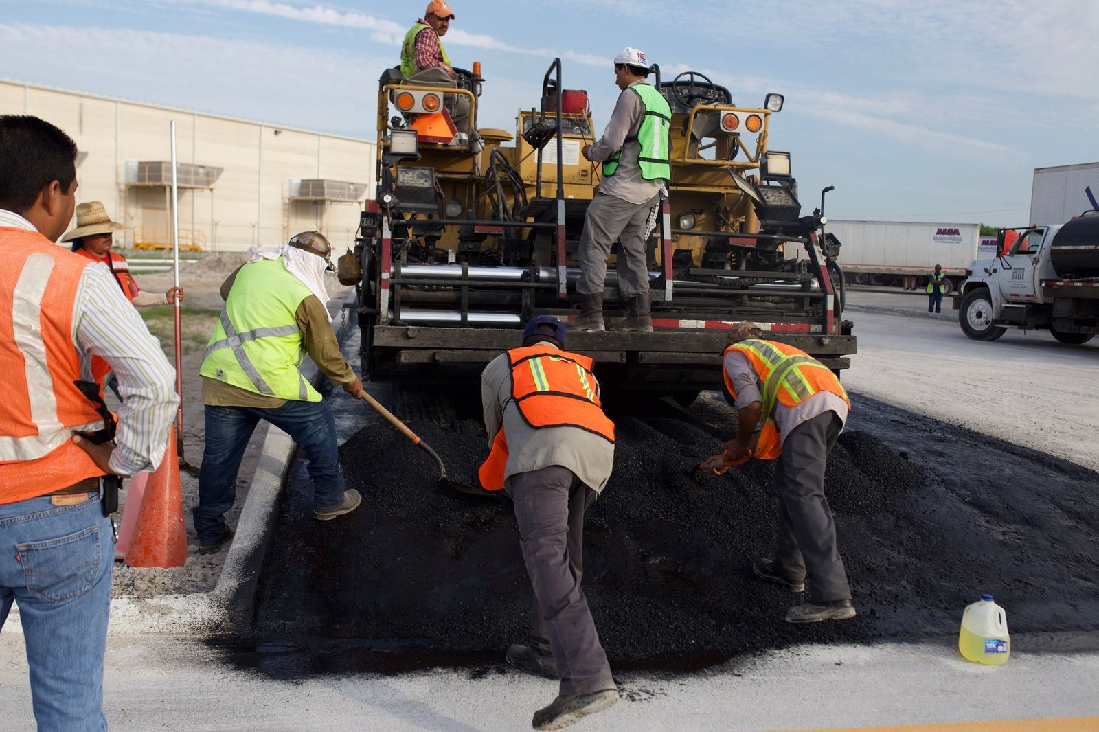 Road paving crew resurfacing a residential street in Argyle, Texas