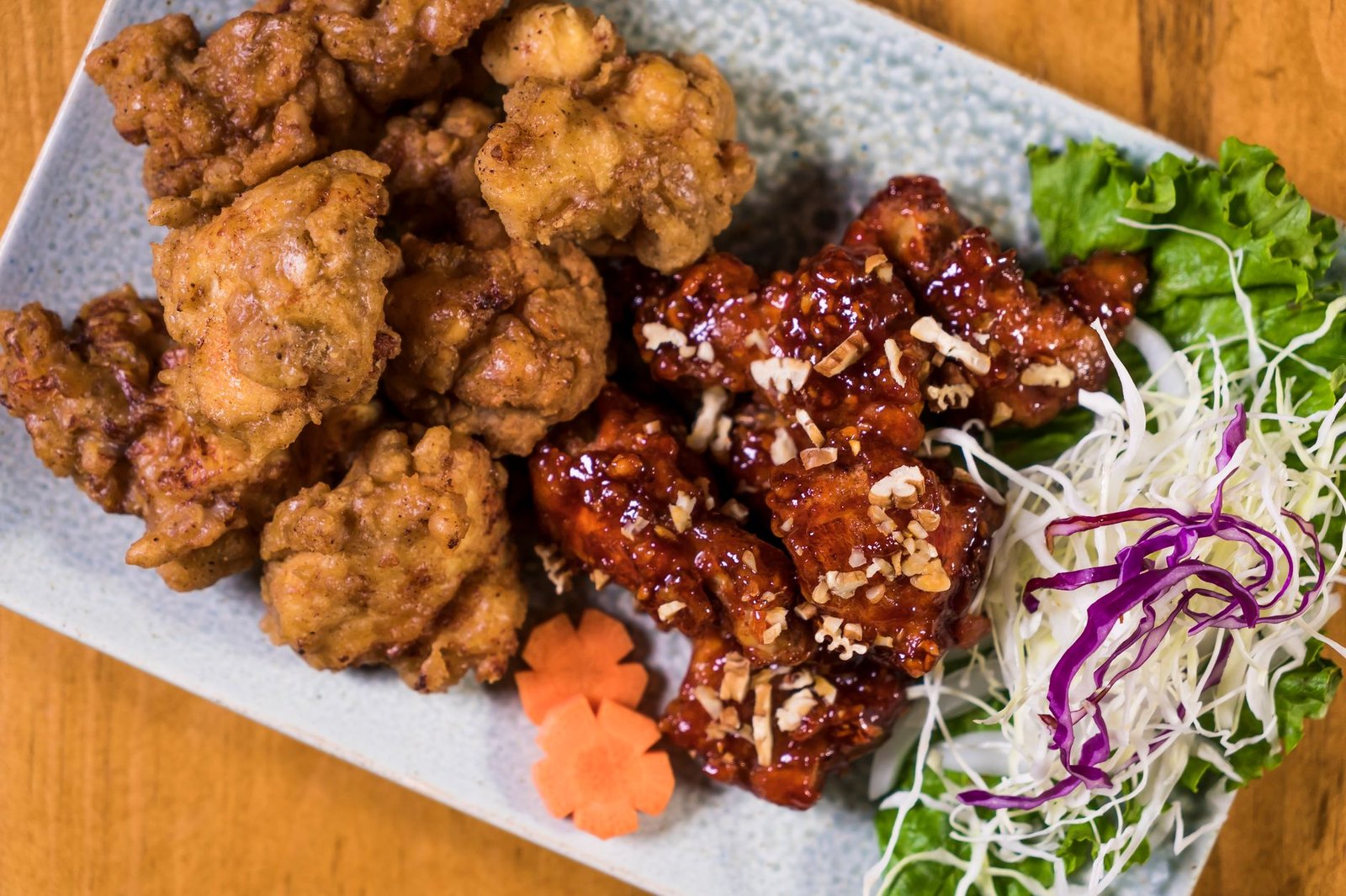 Crispy Korean fried chicken wings glazed with soy garlic sauce on a plate