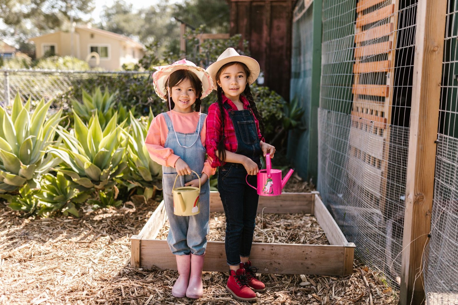 Children gardening raised bed outdoors