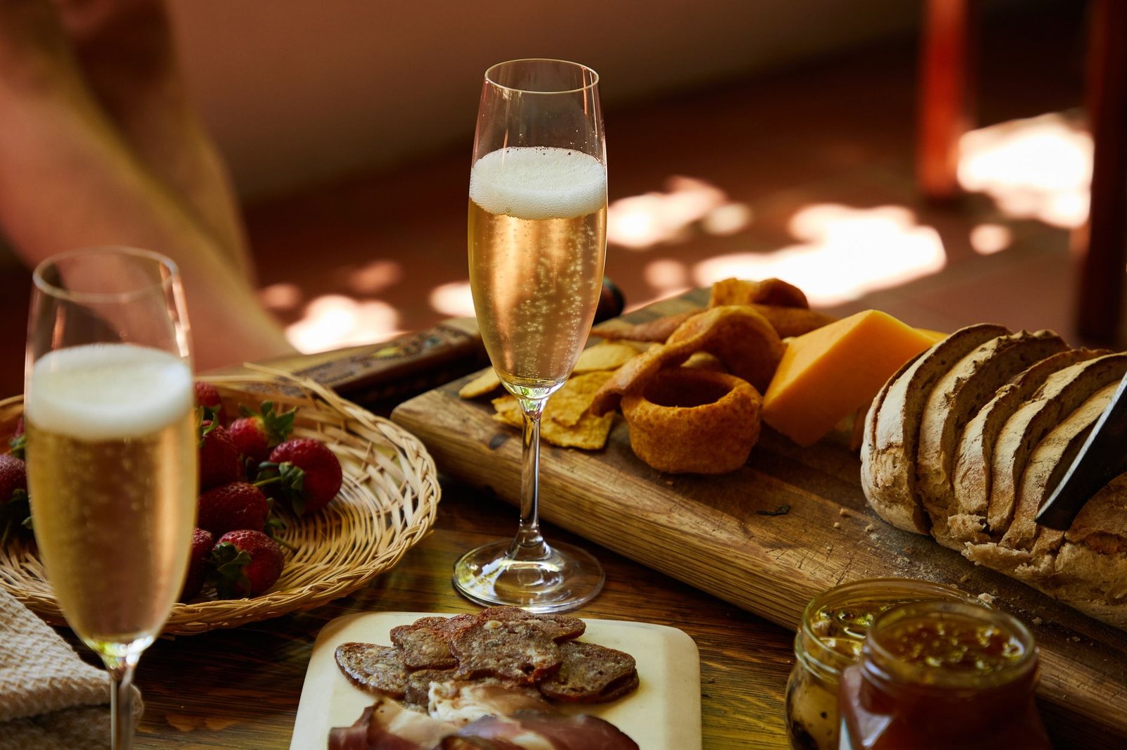 Champagne flutes and charcuterie board for a celebration tasting