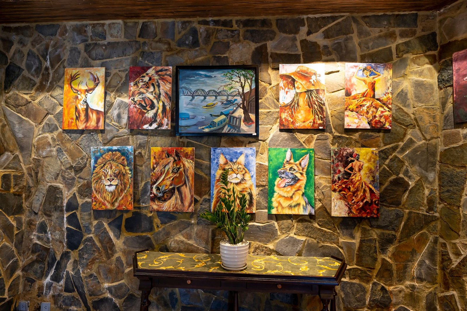 Colorful animal paintings hanging on an interior display wall
