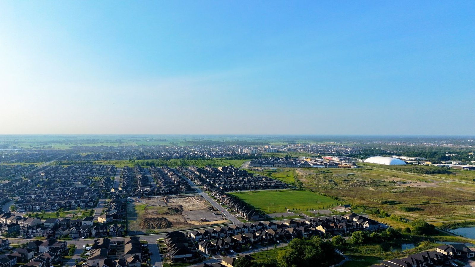 Suburban residential development construction site with roads and lots