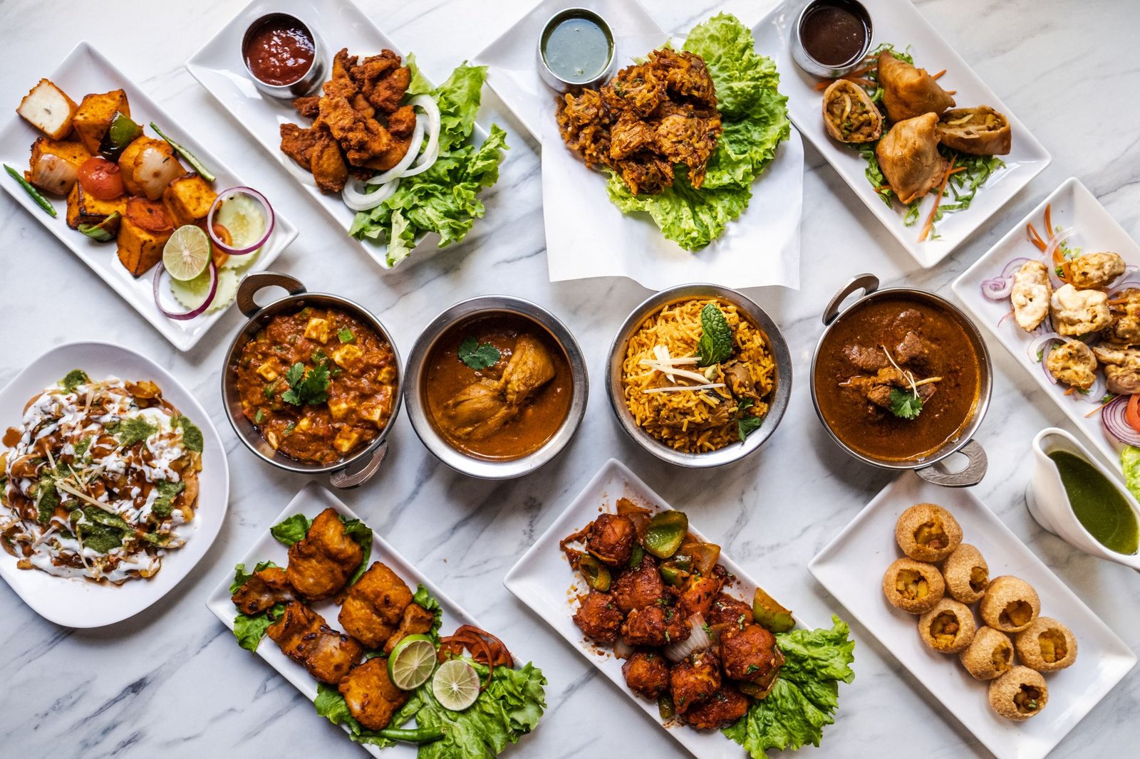 Plates of biryani and flame-grilled kebabs at an Indian fusion restaurant