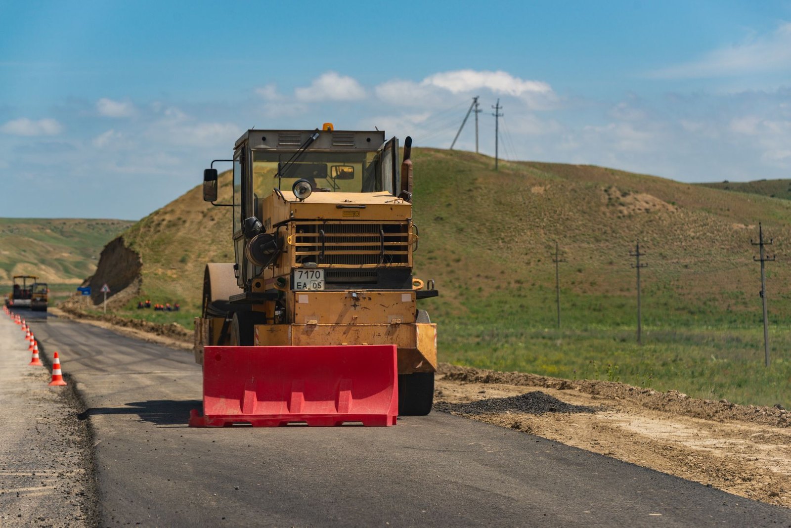 Construction zone on E. Jeter Road in Bartonville, TX, with orange cones and equipment visible on a rural road