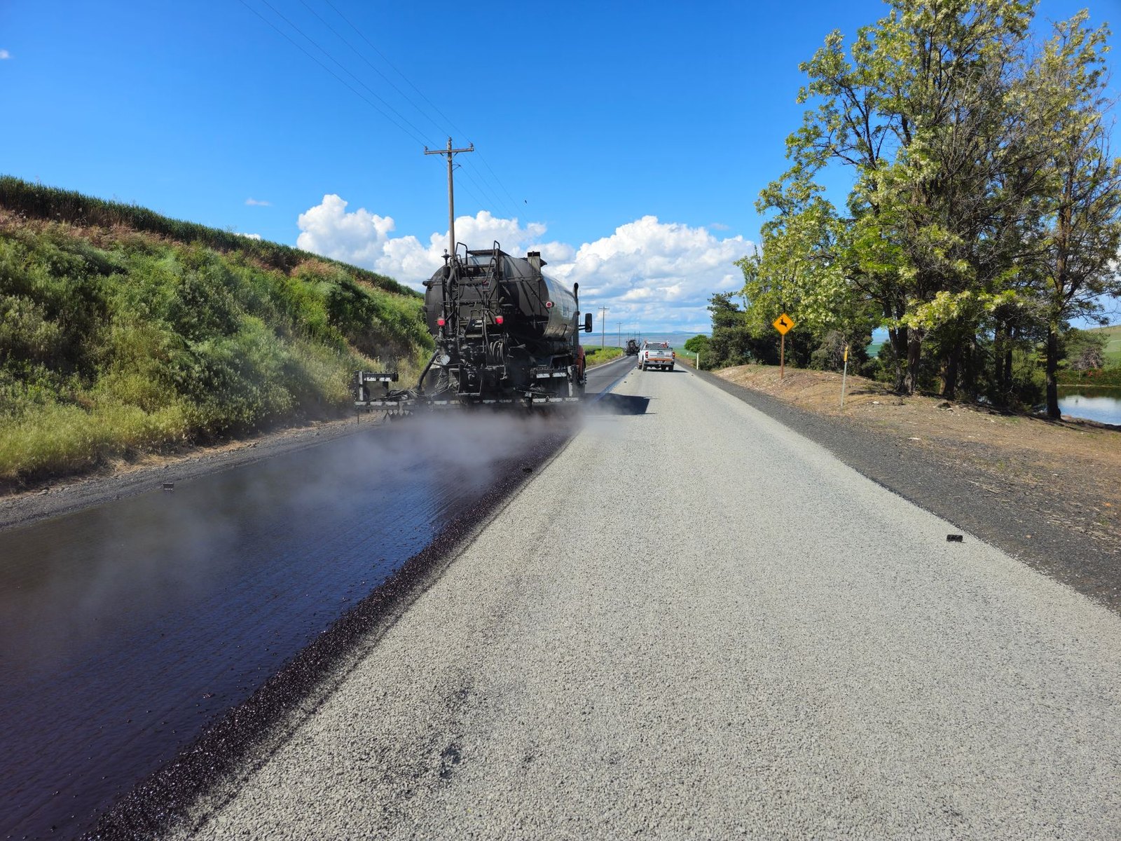 Residential street asphalt resurfacing road crew