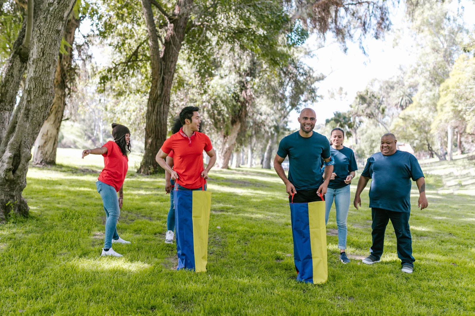 Kids competing in field day relay races at an outdoor community event