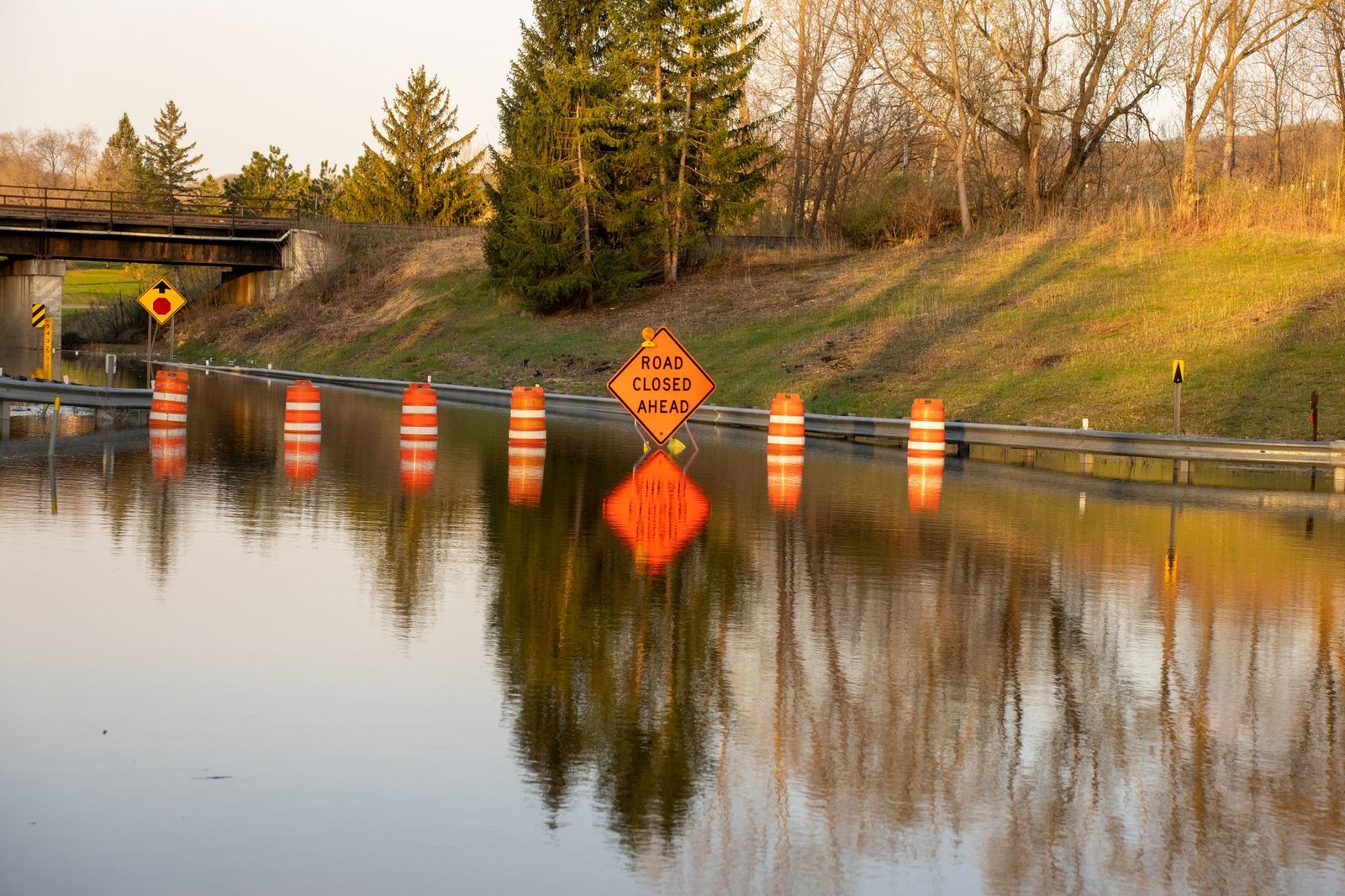 Flooded low-water crossing with road closed sign