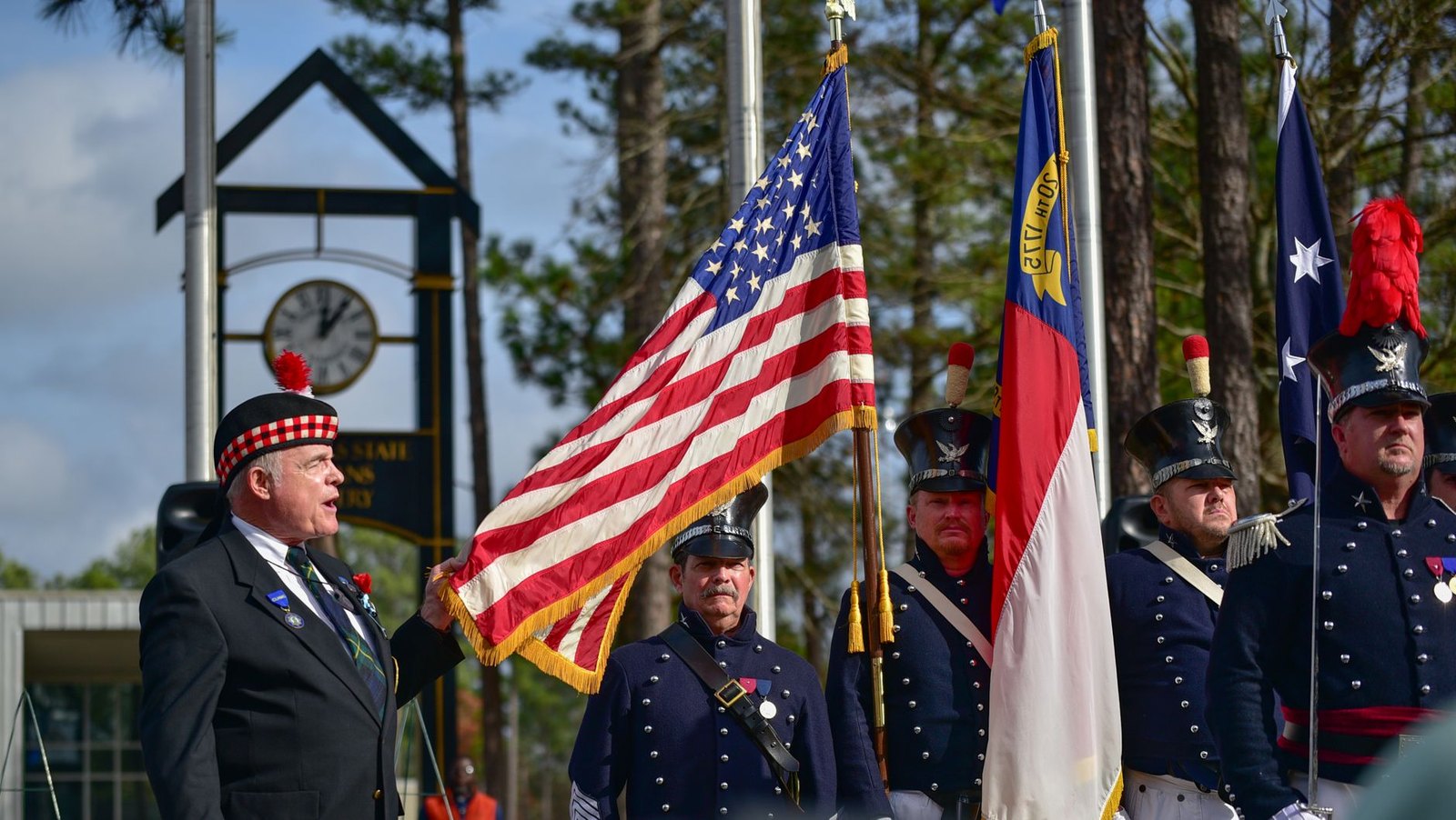 American flag at an outdoor morning remembrance ceremony