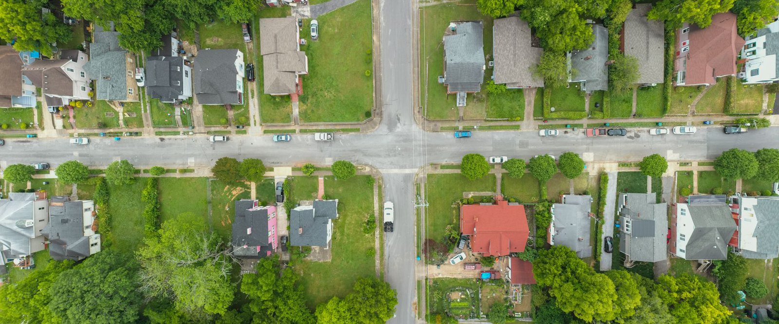 A tree-lined residential street in Flower Mound representing homeowners affected by property tax rate decisions