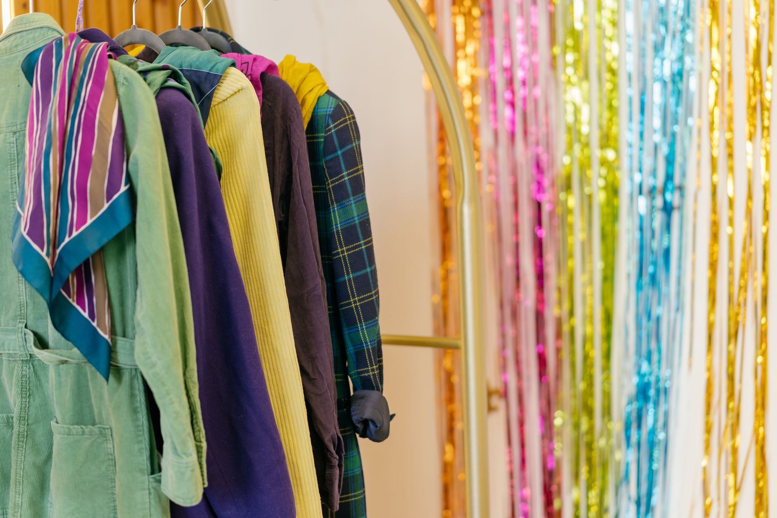 A rack of assorted Halloween costumes in various sizes