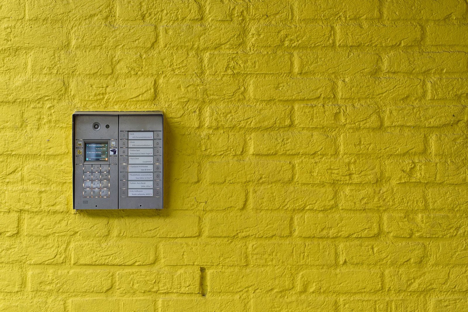 Homeowner adjusting an outdoor irrigation timer controller
