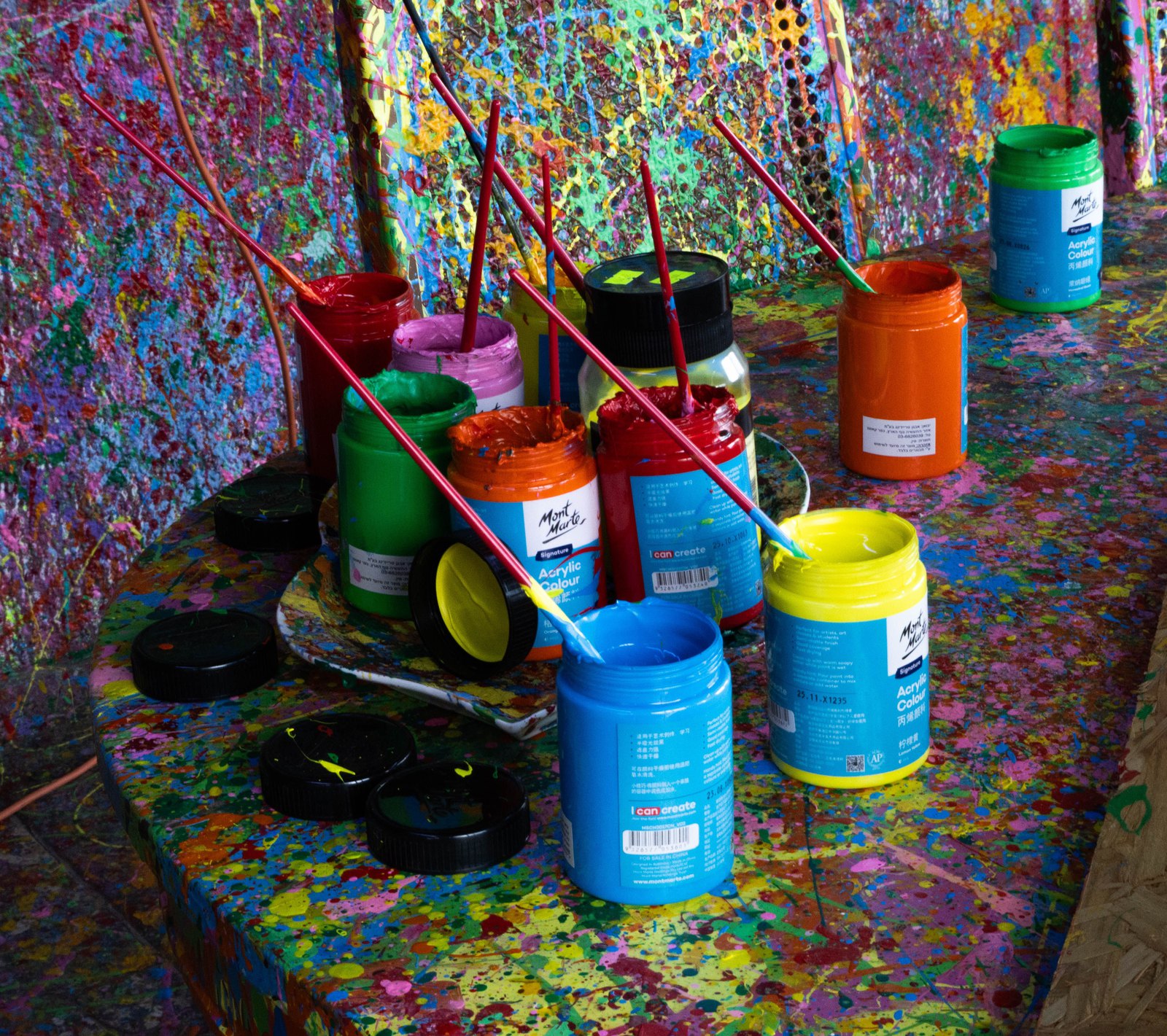 Interior of a smash room with safety gear and items ready to break
