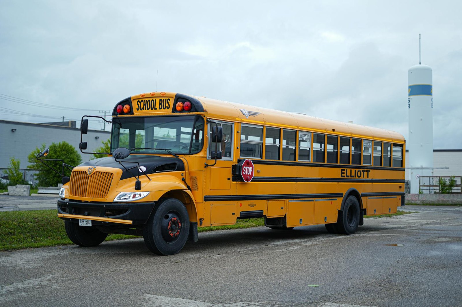 Yellow school bus parked outside an LISD elementary school in Flower Mound
