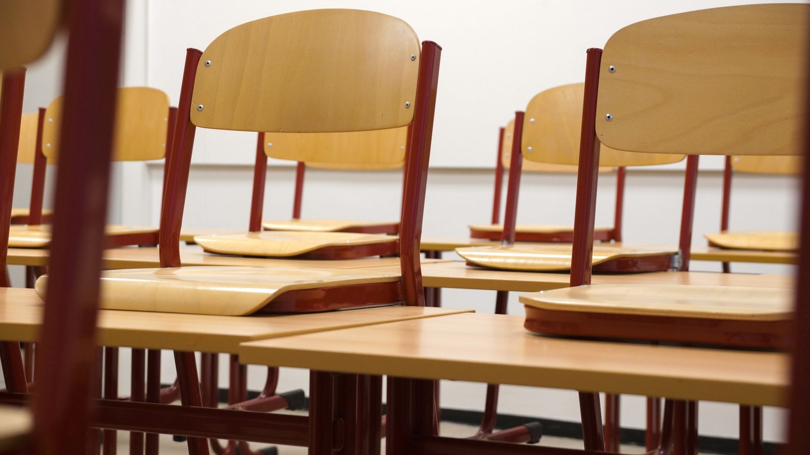 School board meeting room with empty chairs