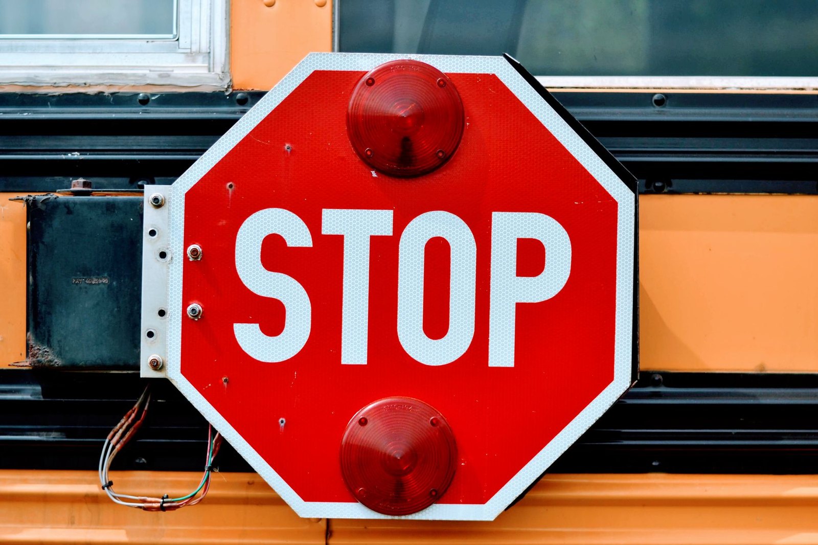 Flashing school zone speed limit sign on a suburban Texas road in the morning
