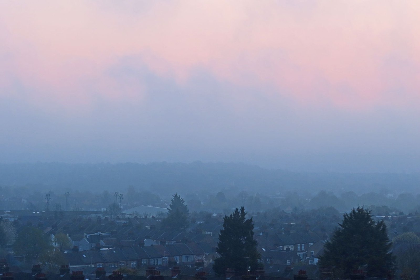 Hazy midday sky over a North Texas residential neighborhood on an ozone action day