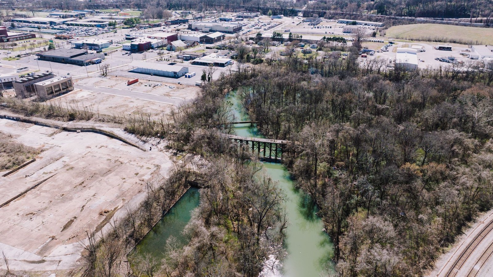 The tree-lined waterway and trail at the Flower Mound River Walk, site of the planned Arts Center