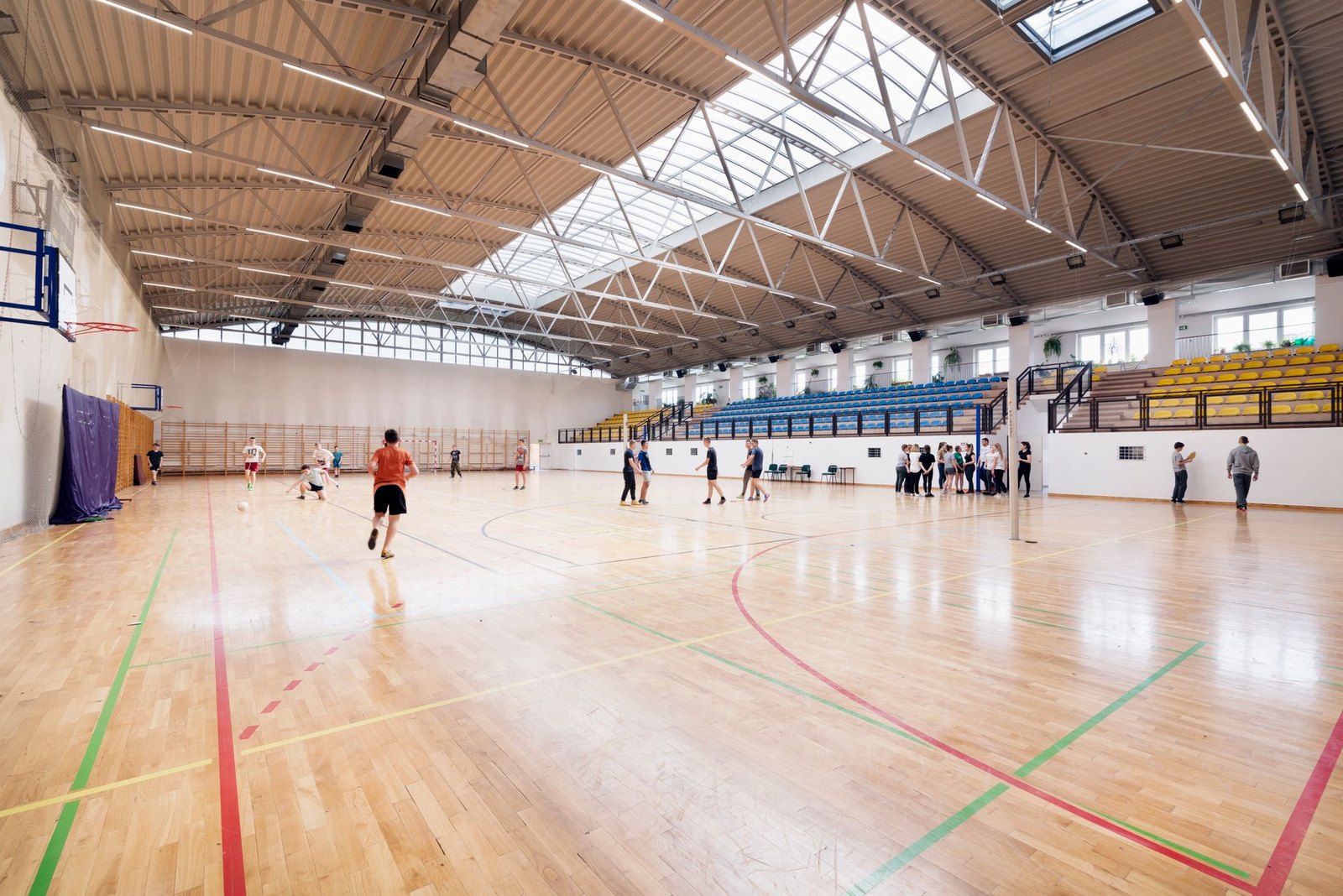Indoor multi-sport basketball courts inside a community recreation center