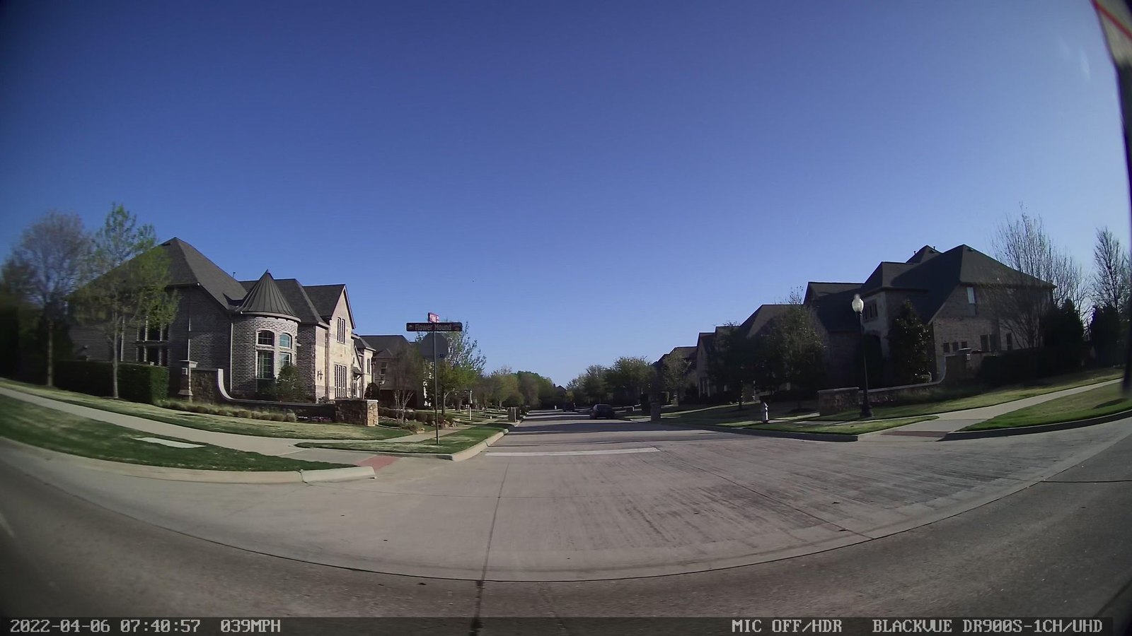 Street-level view of the FM 2499 and FM 3040 intersection in Flower Mound, TX, showing existing traffic conditions