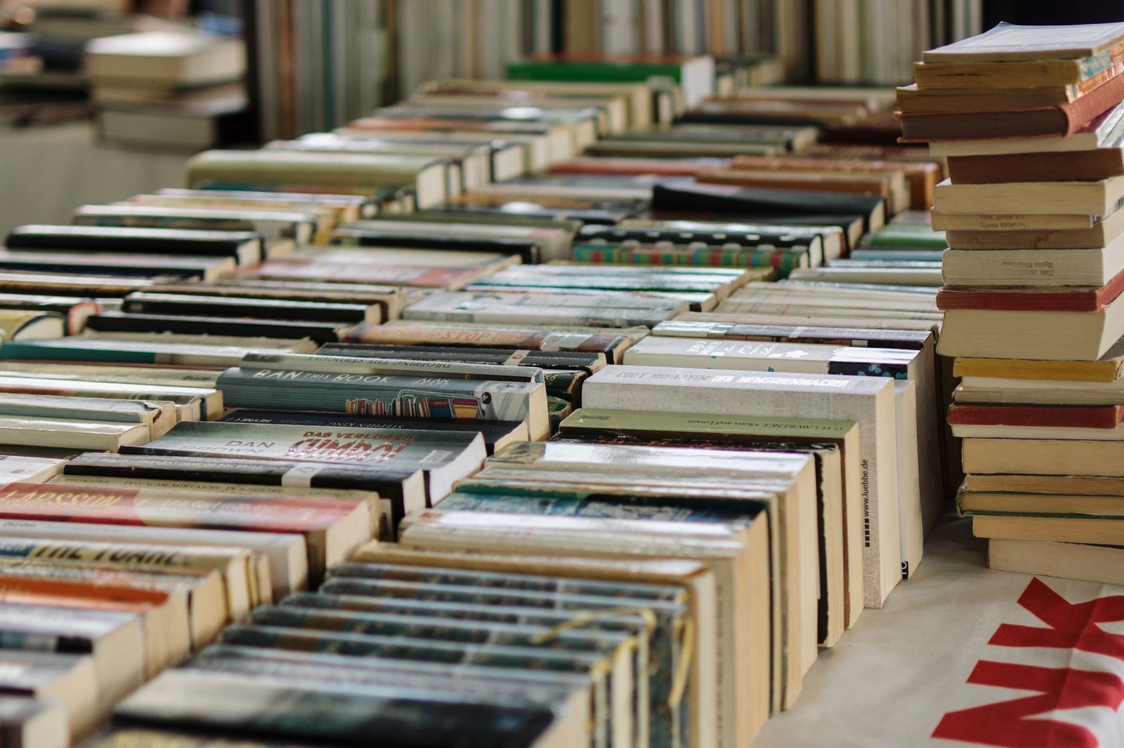 Used books on tables at a library book sale