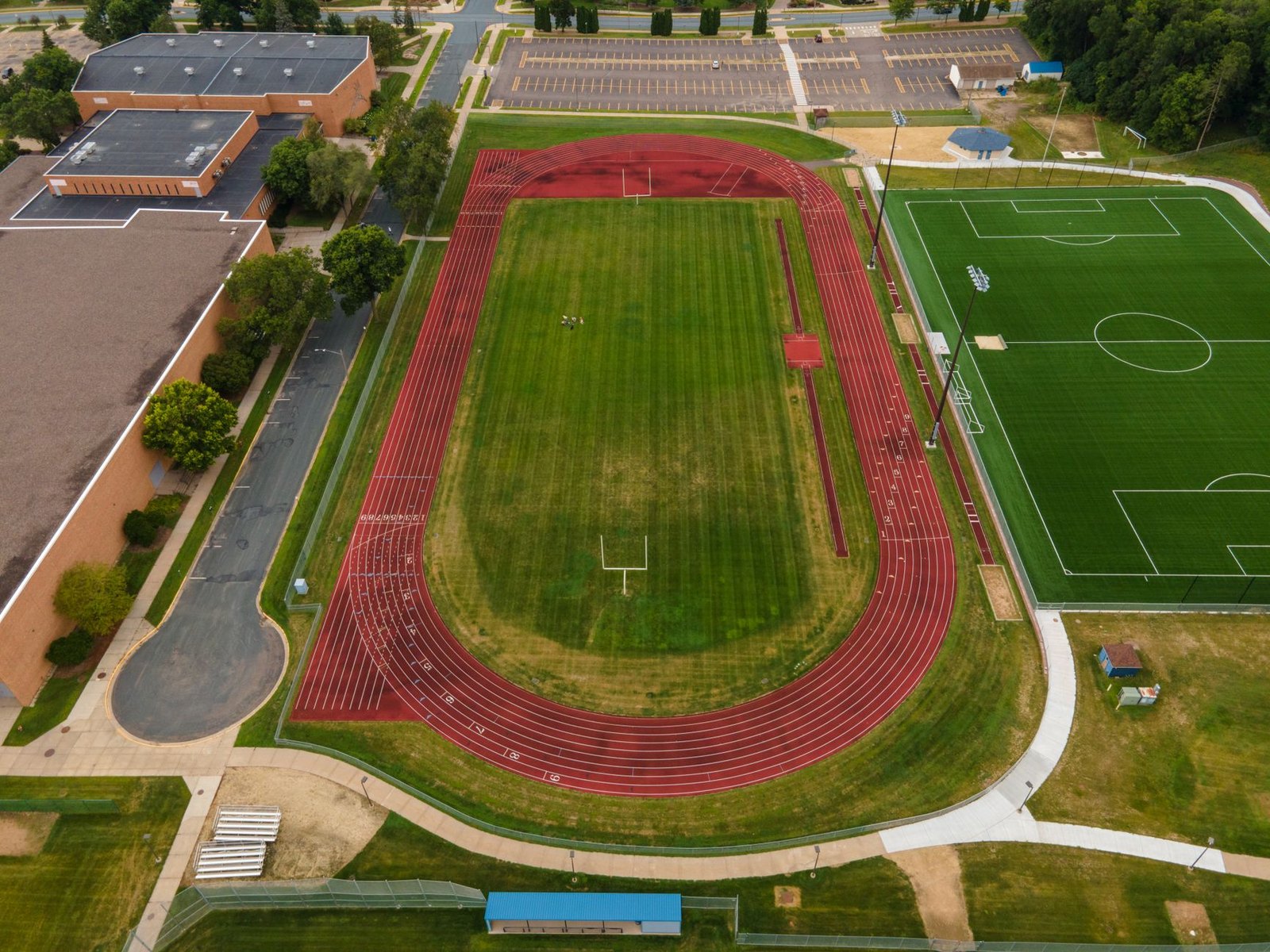 High school runners competing on an outdoor track at a UIL state-level meet