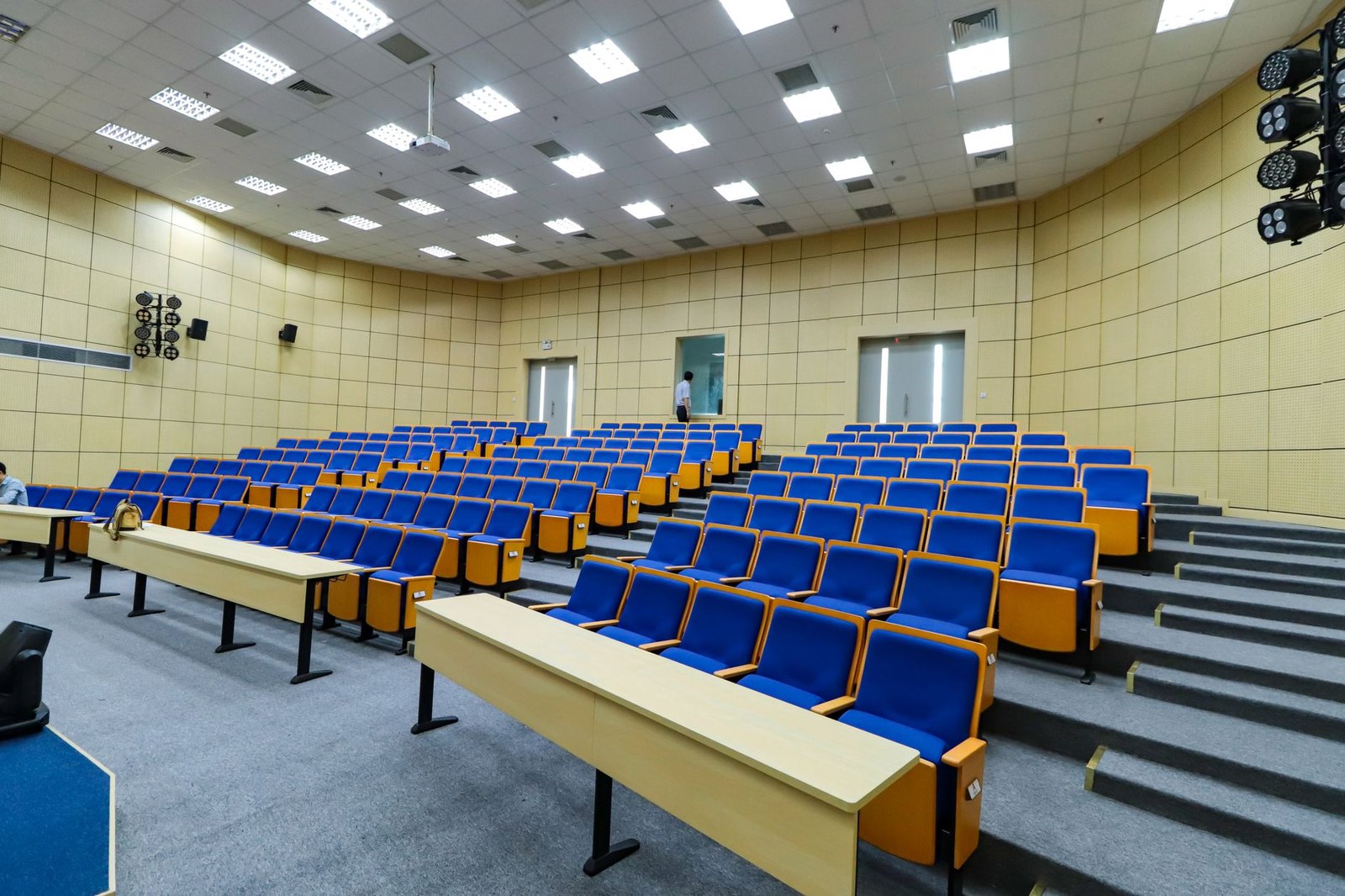 High school lecture hall community meeting rows of chairs
