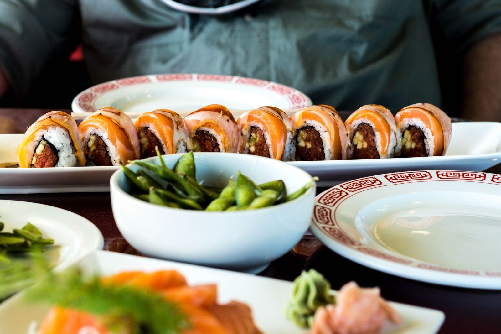 Assorted sushi rolls and nigiri served on a wooden board